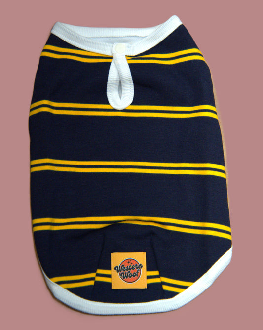 Navy blue dog sweater with yellow stripes on a brown background